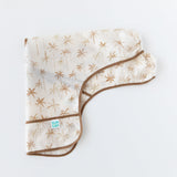 Bumkins Sleeved Bib: Palm Daze is folded lengthwise on a white background.