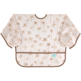 Bumkins Sleeved Bib: Palm Daze features waterproof fabric, a light brown palm tree pattern, and a pocket—ideal for baby-led weaning.