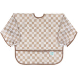 Bumkins Sleeved Bib: Sand Check is made of tan checkered waterproof fabric with elastic cuffs; perfect for baby-led weaning.
