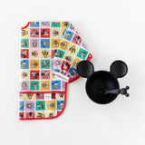Bumkins Sleeved Bib: Mickey & Friends Check Mates is shown folded on a white background next to a black Mickey-shaped bowl with spoon.