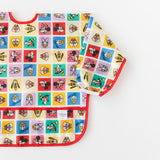 Bumkins Sleeved Bib: Mickey & Friends Check Mates is shown flat on a white background.