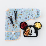 Bumkins Sleeved Bib: Mickey + Minnie Sunny Side Up is folded on a white background next to a Mickey-shaped plate and matching utensils.