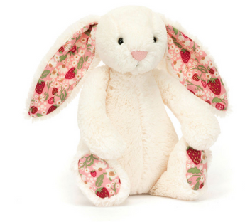 The Jellycat Blossom Bunny Berry Little is a plush white bunny with Bashful fur and pink floral-patterned ears, sitting upright.