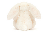A Jellycat, Blossom Bunny Berry Little with bashful fur and long ears sits elegantly on a pristine white surface.