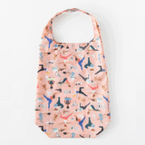 Bumkins Packable Tote Bag: Yoga Pals folds itself into its pocket on a white background in a stop motion GIF.