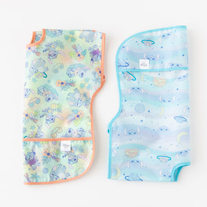 Bumkins Junior Bib 2 Pack: Stitch Star-ring Up Trouble lays folded on a white background.
