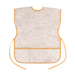 Bumkins Short-Sleeved Smock: Wander features beige waterproof fabric with a white abstract pattern, orange trim, adjustable ties and a pocket.