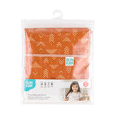 Bumkins Short-Sleeved Smock: Grounded is shown folded in plastic packaging bag with a hanger and cardboard insert.