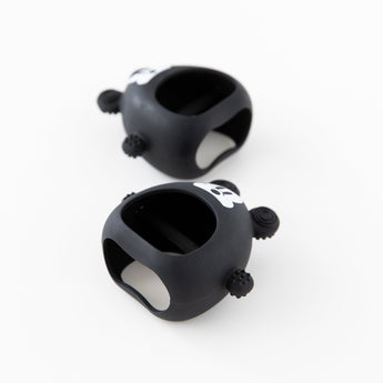 Two Bumkins Silicone Un-Droppable Mitt Teether: Mickey Mouse lay angled on a white background.