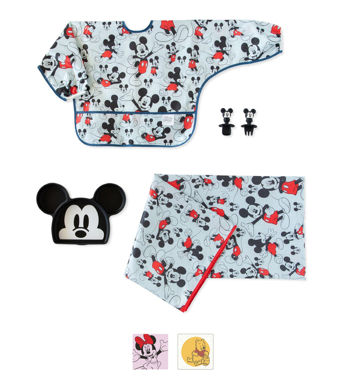 Set of Mickey Mouse-themed baby items: bib, plate, utensils, placemat, and napkin, all with black, red, and grey designs.
