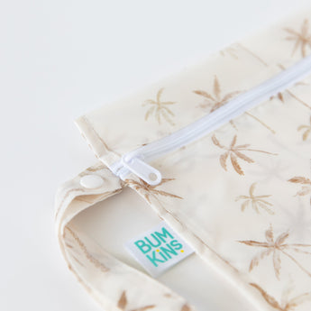 Close-up of Bumkins Wet Bag: Palm Daze, featuring a palm tree pattern and white zipper; a waterproof, eco-friendly choice.