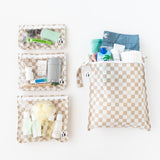 Bumkins The Chaos Coordinator Essential 4-Piece Set: Sand Check holds toiletries and beach essentials on a white background.