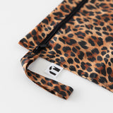 Close-up of Roamio by Bumkins Wet Bag: Leopard on a white background, with focus on the zipper and side handle.