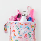 Bumkins Wet Bag: Boots holds sunglasses, a swimsuit, water bottle, and sunscreen on a white background.