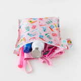 Bumkins Wet Bag: Boots is shown unzipped on a white background, revealing a water bottle, sunscreen, swimsuit, and sunglasses inside.