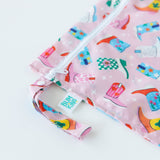 Close-up of Bumkins Wet Bag: Boots on a white background, showcasing the zipper and snap-closure strap.