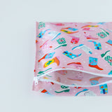 Bumkins Wet Bag: Boots sits open on a white background, revealing the inside of the bag.