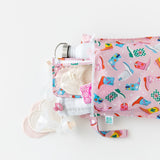 Bumkins Wet Bag: Boots holds a breast pump, a water bottle, and breast pads on a white background.