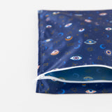 Bumkins Wet Bag: Evil Eye lays flat on a white background, partially open.