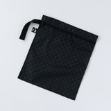 Roamio by Bumkins Wet Bag: Rich Black rests flat on a white background.