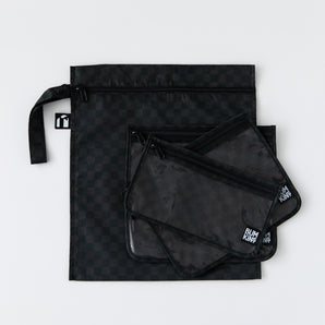 Bumkins The Chaos Coordinator Essential 4-Piece Set: Rich Black lays stacked on a white background.