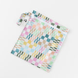 Roamio by Bumkins Wet Bag: Motley Check lays flat on a white background.