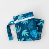 Bumkins Wet Bag: Blue Tropic lays folded on a white background.