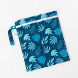 Bumkins Wet Bag: Blue Tropic lays flat on a white background.