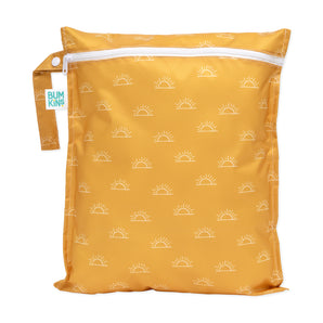 Bumkins Wet Bag: Sunshine has a yellow design with white sun pattern, a white zipper, and a waterproof fabric strap.