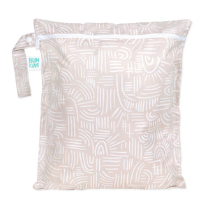 Bumkins Wet Bag: Wander is a beige waterproof bag with white abstract patterns, a zipper, and a handle—perfect for reusable needs.