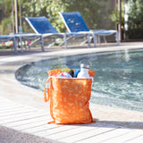 Packing essentials: Bumkins Wet Bag + Wet/Dry Bag Set: Grounded by the pool with a water bottle and towels.