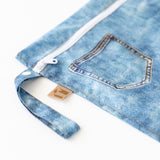 Close-up of Roamio by Bumkins Wet Bag: Vintage Denim on a white background, with focus on the zipper and side handle.