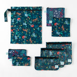 Bumkins Wet Bag: Jungle lays flat among other bags with similar prints on a white background.