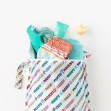 A bag from Bumkins The Chaos Coordinator Deluxe 5-Piece Set: Disney Mickey & Friends Varsity holds swim gear on a white background.
