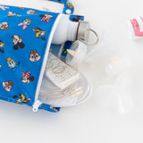 Bumkins Wet Bag: Mickey & Friends Forever holds a water bottle, tissues, and breast pump parts on a white background.
