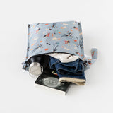 Bumkins Wet Bag: No Tricks, Just Treats showcases a bottle, clothes, and book against a crisp white backdrop.