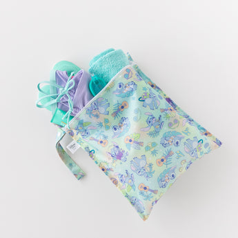 A bag from Bumkins On-The-Go Mealtime 7-Piece Set: Stitch Star-ring Up Trouble holds pool essentials on a white background.