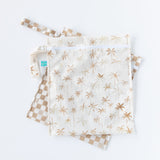 Bumkins Wet Bag 2 Pack: Palm Check, featuring two waterproof bags with palm tree and checkered patterns, lays overlapped on a white background.