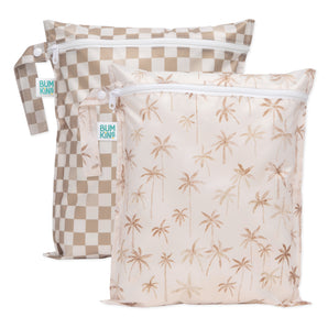 Bumkins Wet Bag 2 Pack: Palm Check includes two waterproof bags with beige checkered and palm print designs, white zippers, and handles.