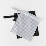 Two Roamio by Bumkins Wet Bag 2 Pack: Rich & Boujee zippered bags with wrist straps overlap on a white background.