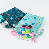 Bumkins Wet Bag 2 Pack (Ocean Life & Jungle) keeps kids’ gear organized with waterproof fabric and snap handles.