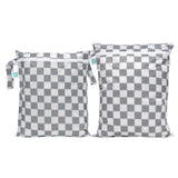 The Bumkins Wet Bag + Wet/Dry Bag Set in Charcoal Check features two reusable bags with a gray and white checkerboard design.