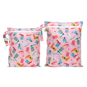 Bumkins Wet Bag + Wet/Dry Bag Set: Boots—2 pink waterproof bags with a colorful cowboy boot pattern and white zippers.