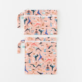 Bumkins Wet Bag + Wet/Dry Clutch Set: Yoga Pals lays neatly arranged on a white background.