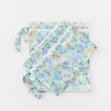 Bumkins Wet Bag + Wet/Dry Clutch Set: Disney Aloha Stitch lays stacked on a white background.