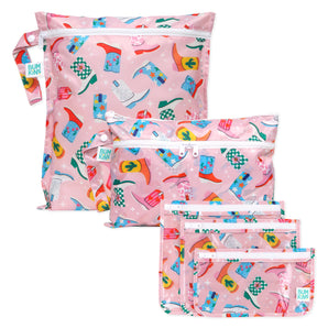 Bumkins The Chaos Coordinator Deluxe 5-Piece Set: Boots—5 pink waterproof bags with a colorful cowboy boot print and zipper closure.