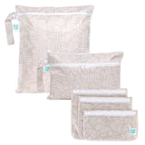 Bumkins Wander Set: Wet Bag, Wet/Dry Clutch & Clear Travel Bag—3 travel essentials in beige and white on a white background.
