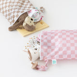 Bumkins Wet Bag Plus 2 Pack: Mauve + Sand Check holds baby items such as books, clothes & toys on a white background.
