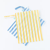 Bumkins Wet Bag Plus 2 Pack: Blue + Yellow Stripe lays stacked on a white background.