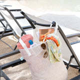 Bumkins Extra Large Wet Bag: Wander hangs on a lounge chair, filled with a towel, sunblock, sunglasses, a hat, a book, and a colorful scarf.